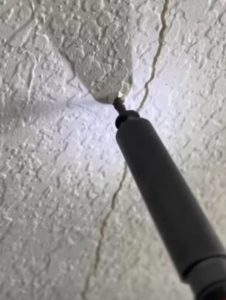 putting screw beside crack